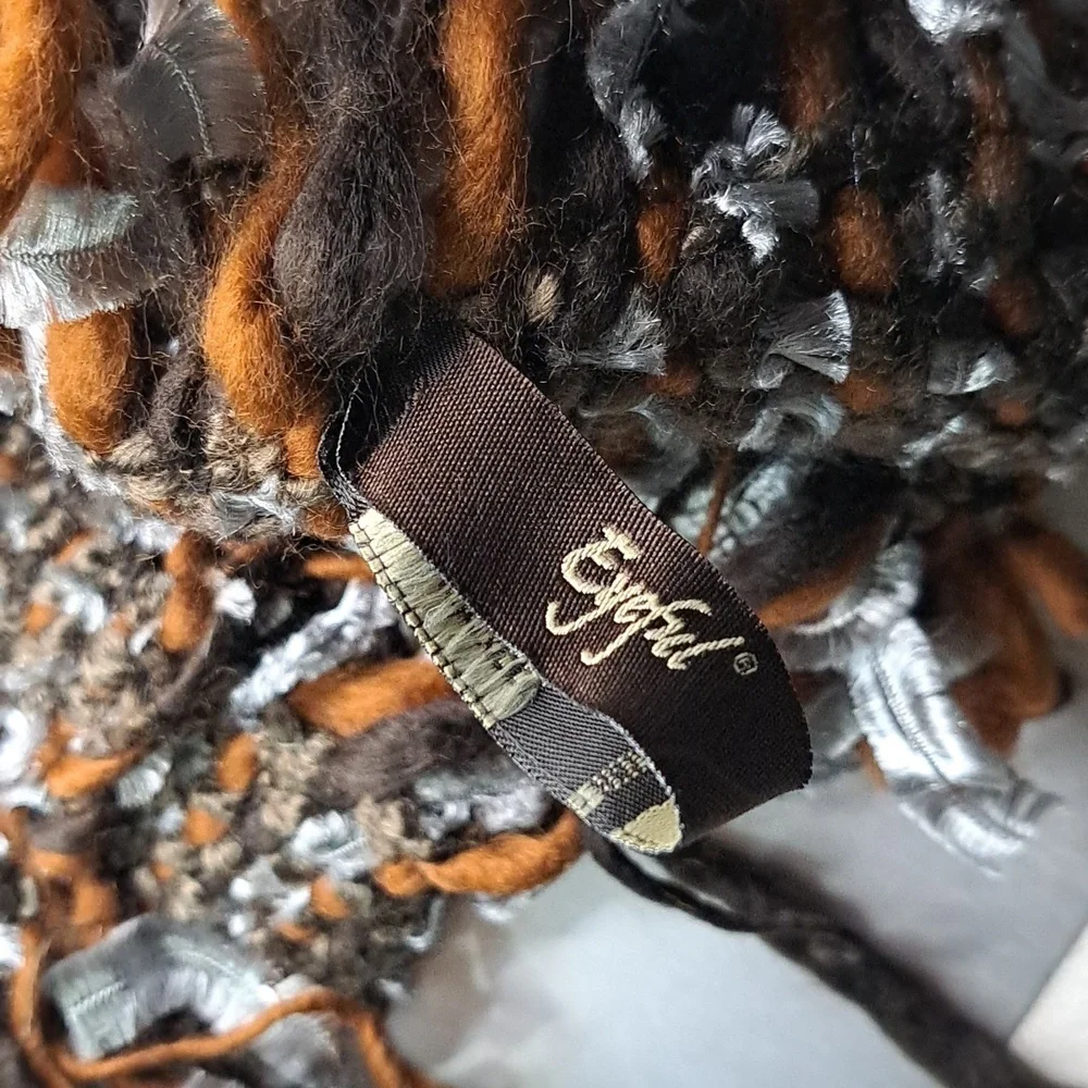 Eyeful Fringe Knit Scarf in Brown And Silver Has Faux Feather Detail